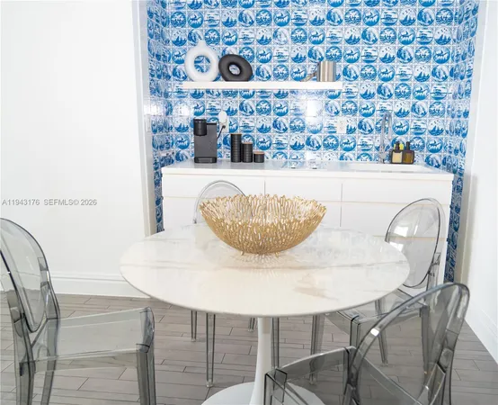 a close view of dining table with chairs