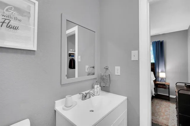 a bathroom with a sink and a mirror