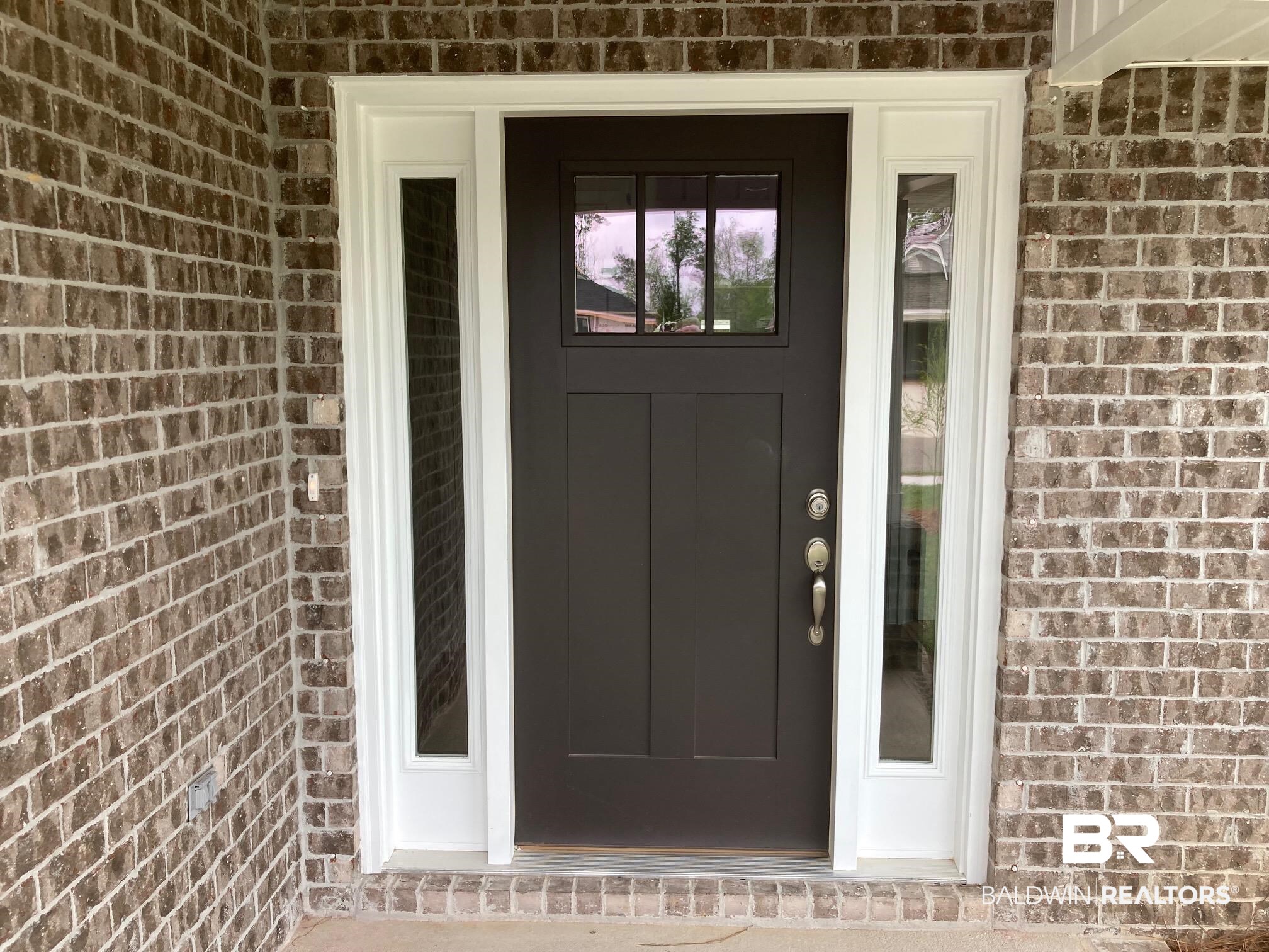 705 Mayflower Drive Foley, AL 36535 - Photo 2 of 19 Entrance to property with brick siding