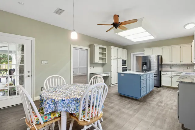 a dining room with furniture and window