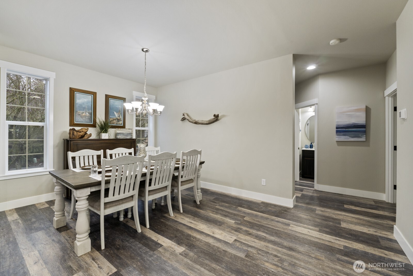 4233 154th Place Southeast Bothell, WA 98012 - Photo 12 of 40 a dining room with furniture window and wooden floor