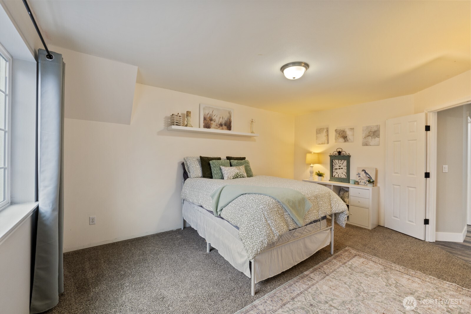 4233 154th Place Southeast Bothell, WA 98012 - Photo 23 of 40 a bedroom with a bed and a painting on the wall
