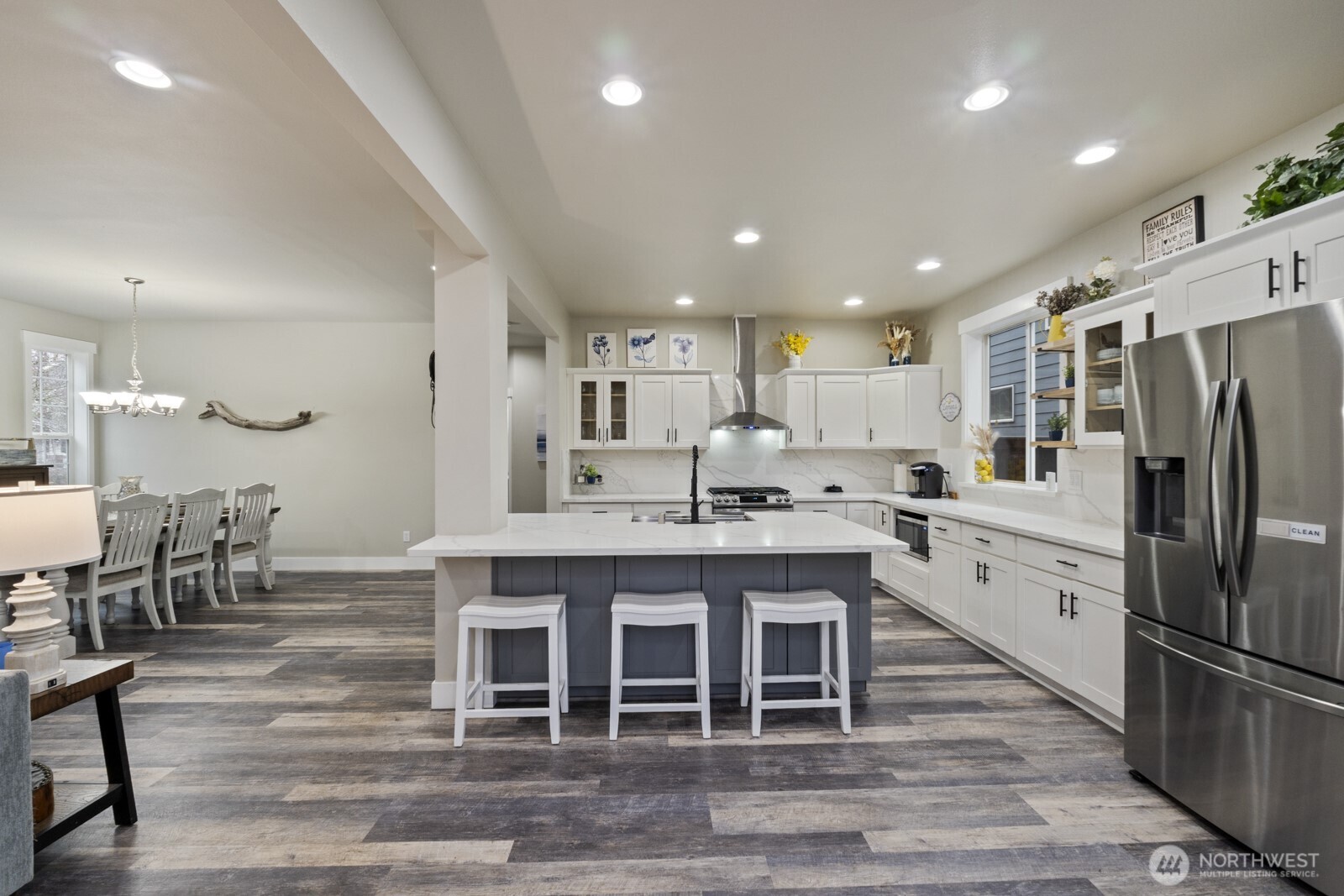 4233 154th Place Southeast Bothell, WA 98012 - Photo 6 of 40 a large kitchen with a table and chairs in it