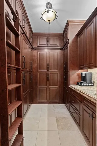 a kitchen with stainless steel appliances a stove and cabinets