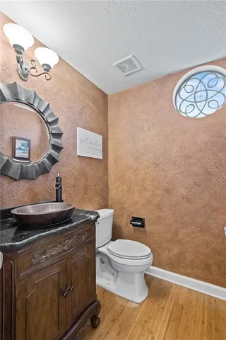 a bathroom with a toilet and a sink
