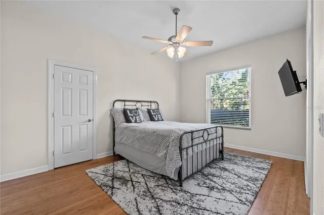 a bedroom with a bed and window