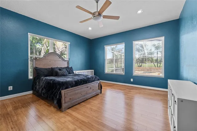 a bedroom with a large bed and a window