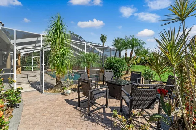 a view of a tables and chairs in patio