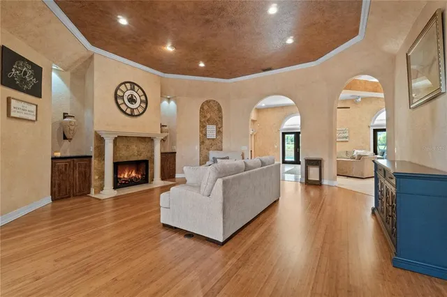 a living room with furniture and a fireplace