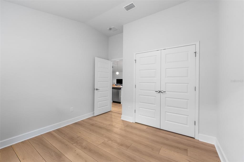 25093 Southwest 23rd Road Newberry, FL 32669 - Photo 25 of 29 wooden floor and white walls