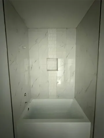 a bathroom with a bathtub