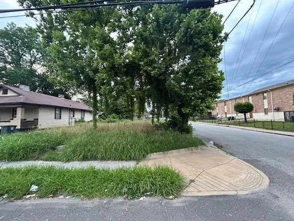 a front view of a house with a yard and a garage