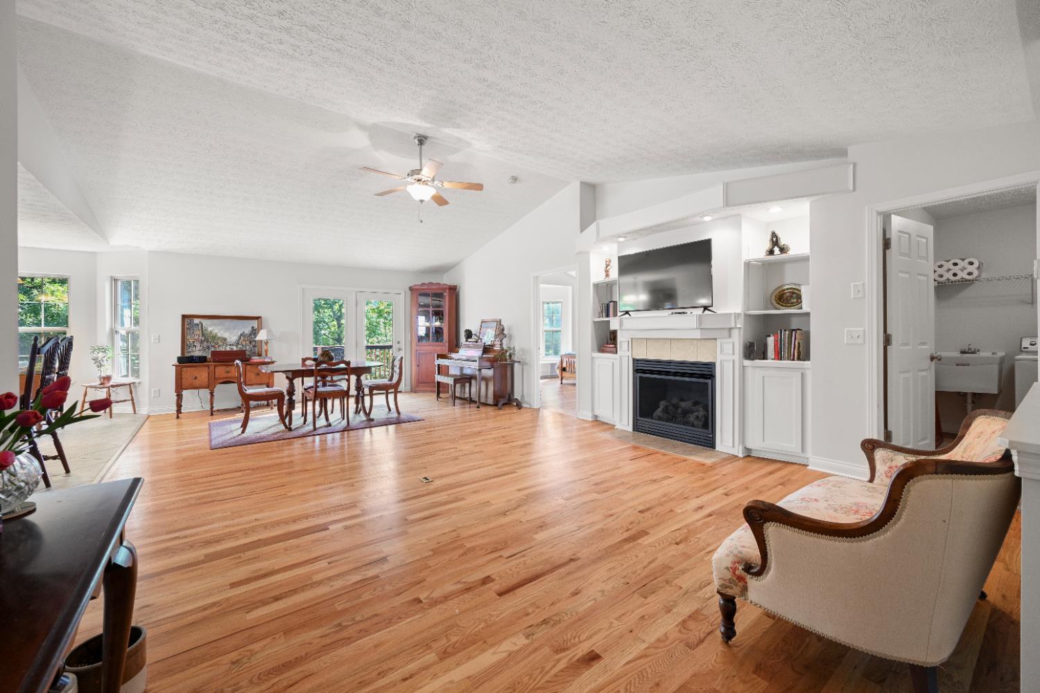 876 Greentree Road Lawrenceburg, IN 47025 - Photo 10 of 49 Spacious, open concept first floor with cathedral ceilings, gas fireplace, and walk-out to back deck