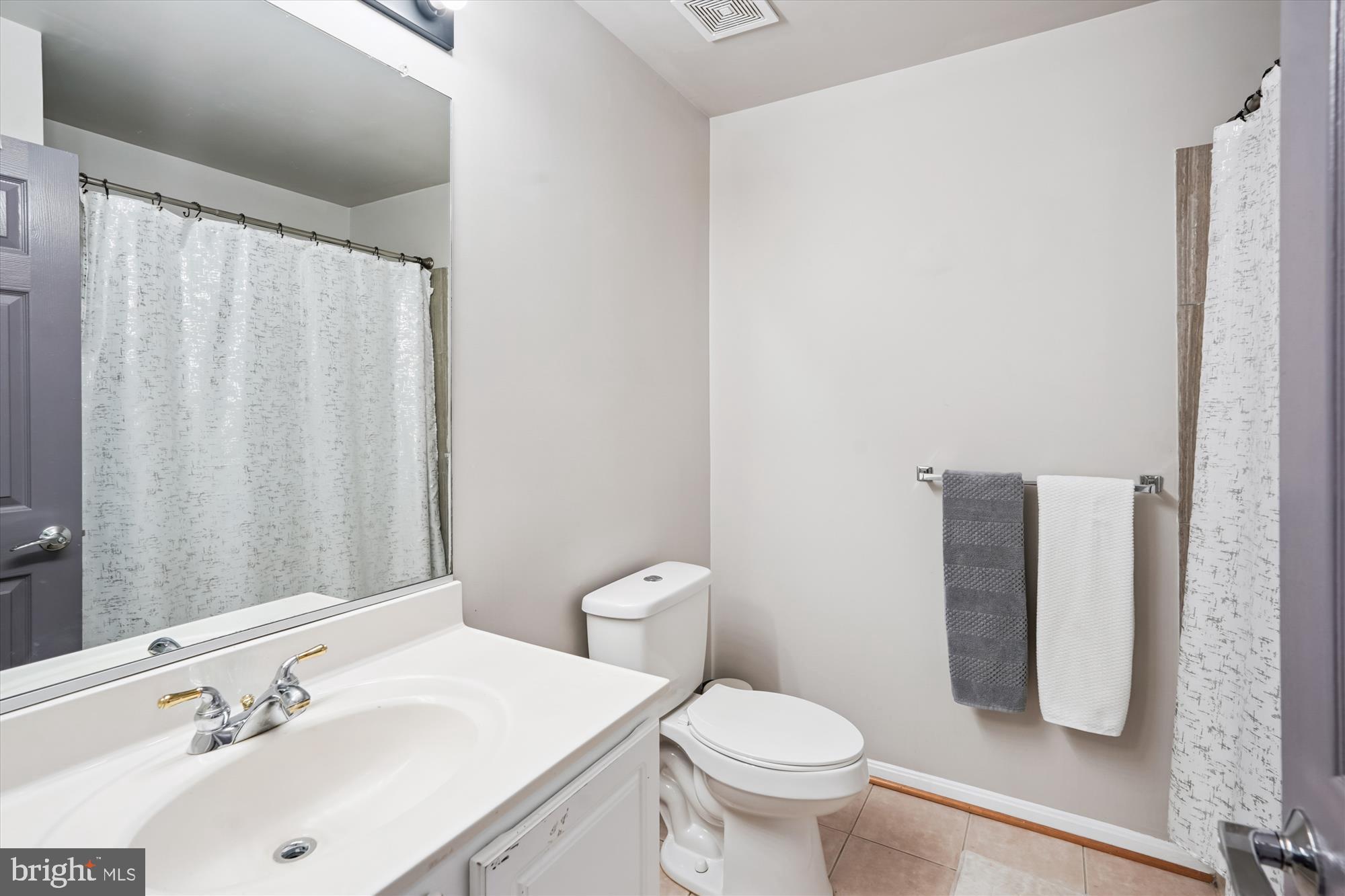 7410 Langholm Way Manassas, VA 20109 - Photo 12 of 18 Modern bathroom with sleek finishes.