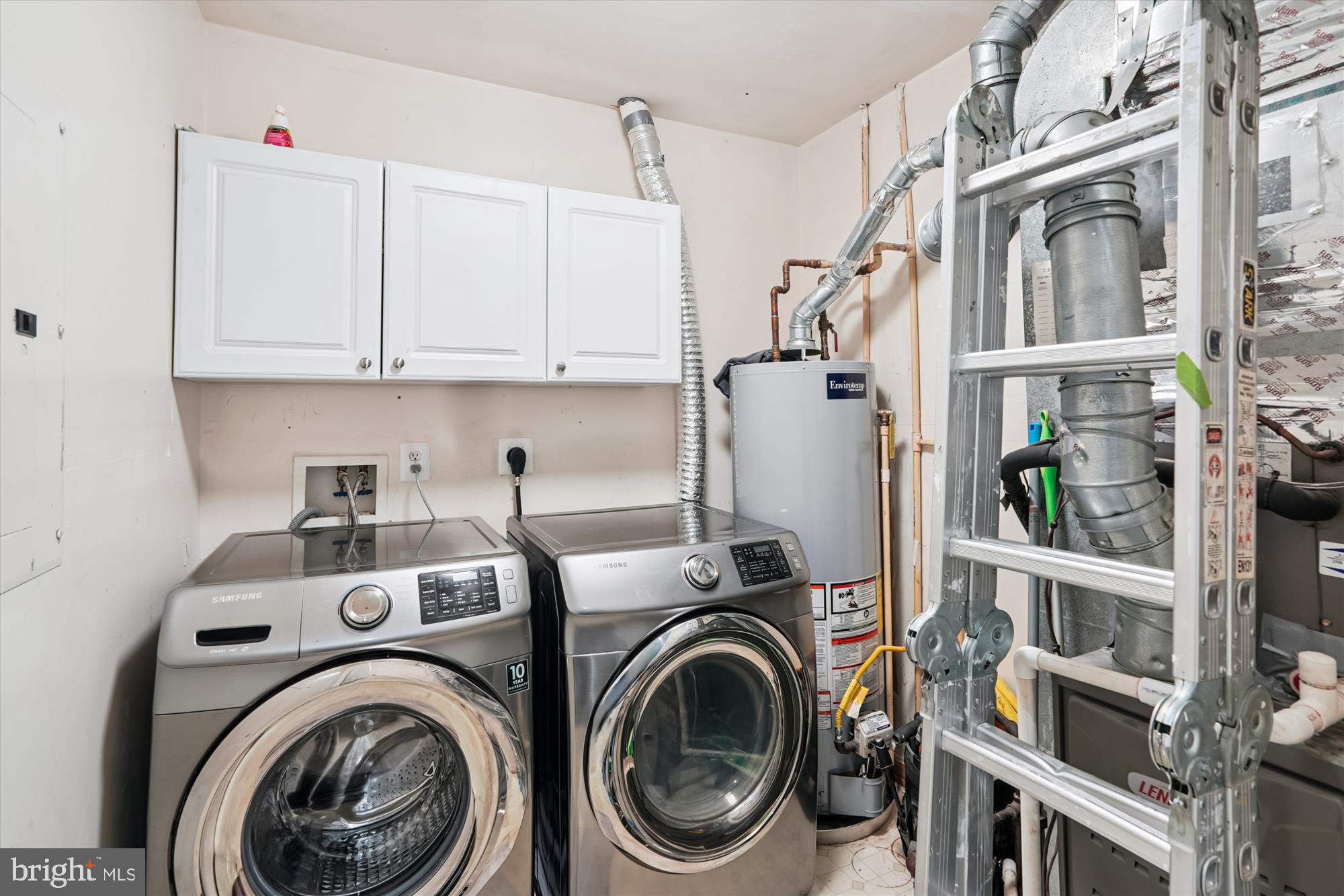 7410 Langholm Way Manassas, VA 20109 - Photo 17 of 18 Modern laundry space with sleek appliances.