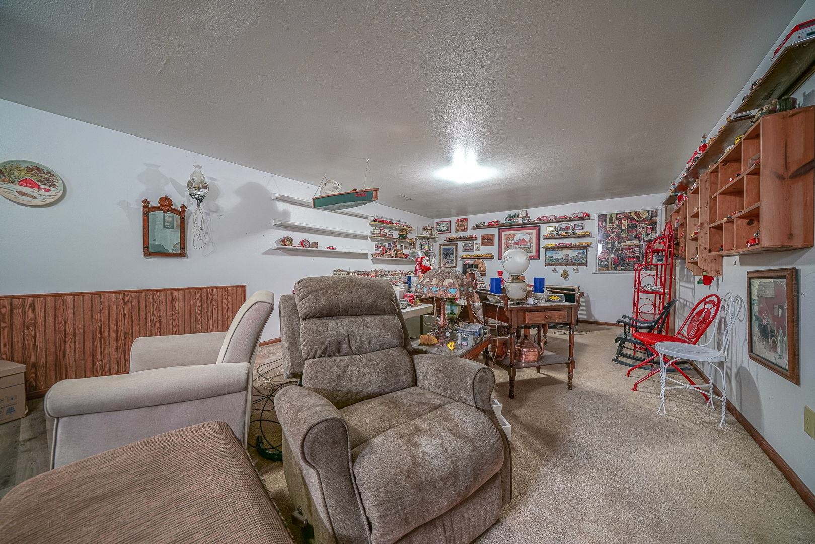 429 North Union Street Byron, IL 61010 - Photo 20 of 22 a living room with furniture and a flat screen tv