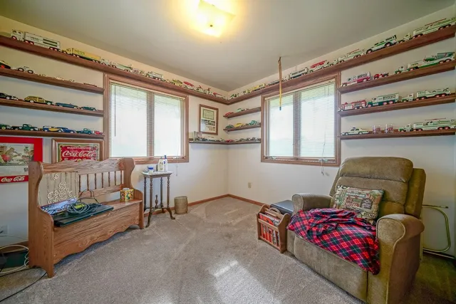 a bedroom with furniture and a window