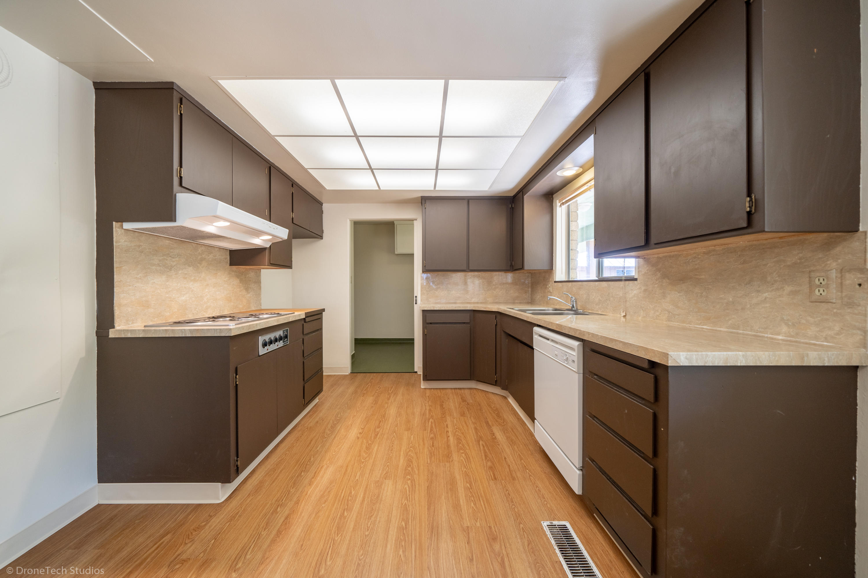36563 Deer Flat Road Shingletown, CA 96088 - Photo 14 of 65 a kitchen with stainless steel appliances granite countertop a sink and wooden cabinets