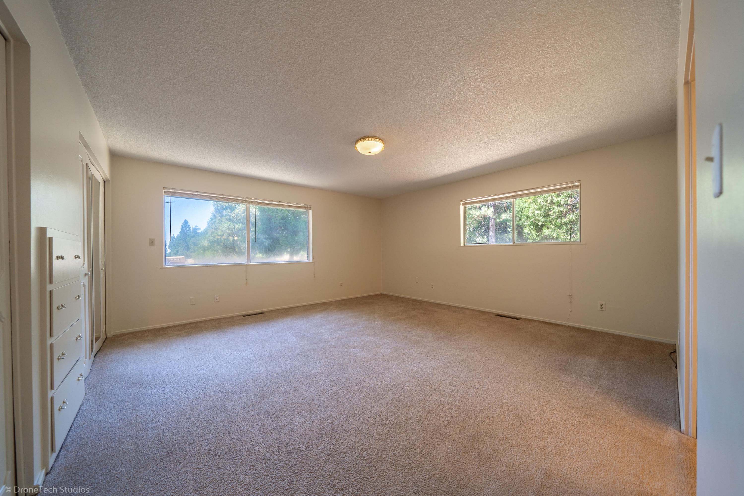 36563 Deer Flat Road Shingletown, CA 96088 - Photo 22 of 65 an empty room with windows