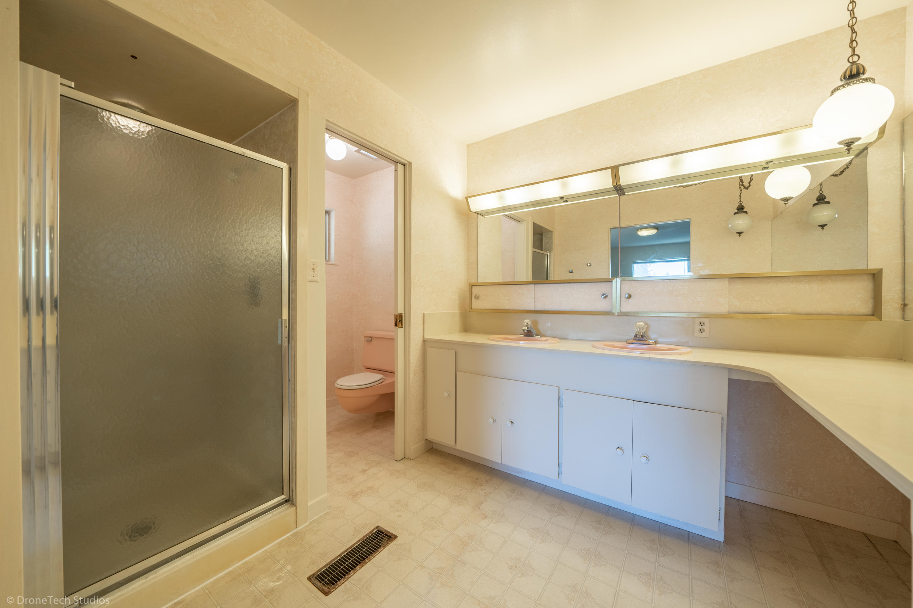 36563 Deer Flat Road Shingletown, CA 96088 - Photo 26 of 65 a spacious bathroom with a shower sink and mirror