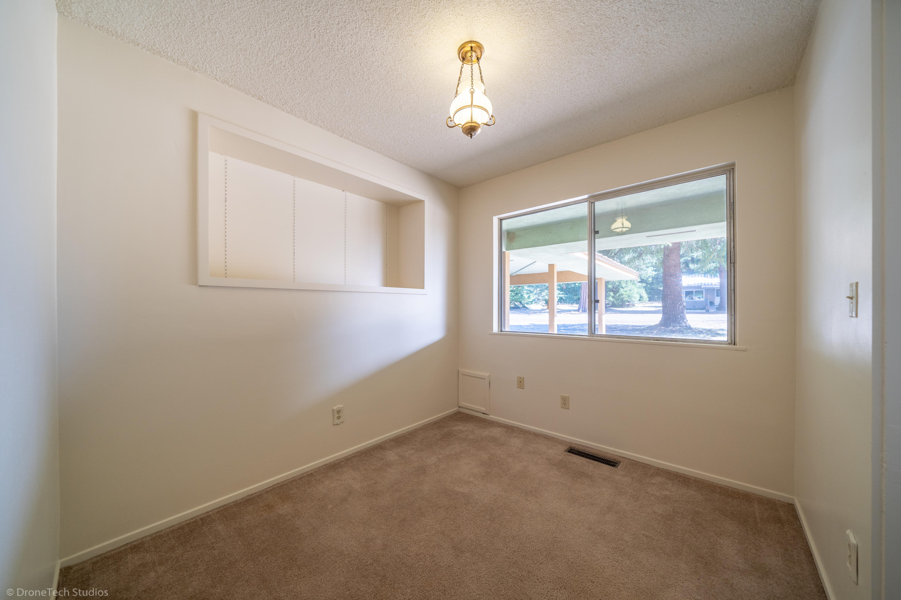 36563 Deer Flat Road Shingletown, CA 96088 - Photo 10 of 65 an empty room with a window