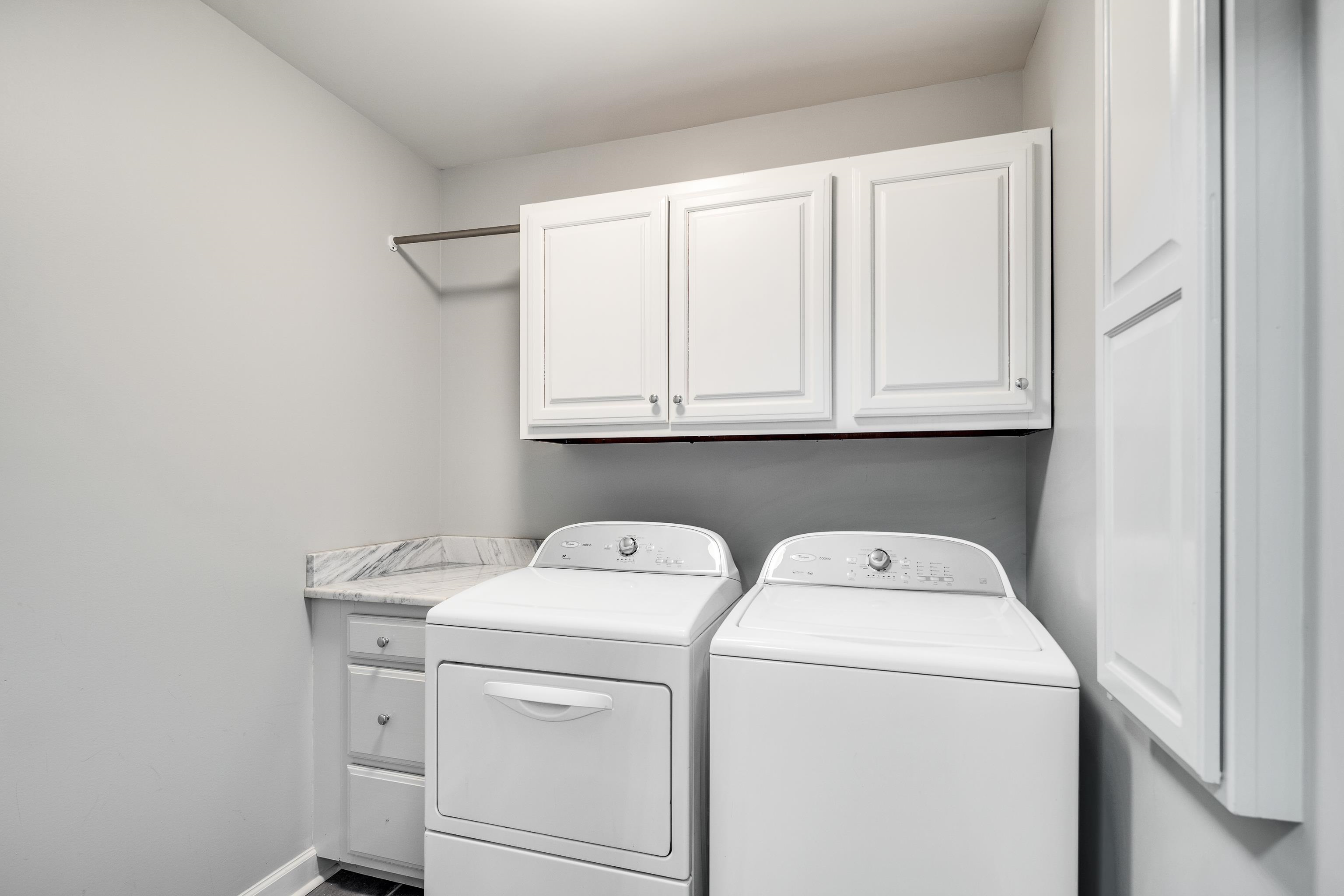 6867 River Birch Road Memphis, TN 38119 - Photo 17 of 40 Laundry room with cabinet space and independent washer and dryer