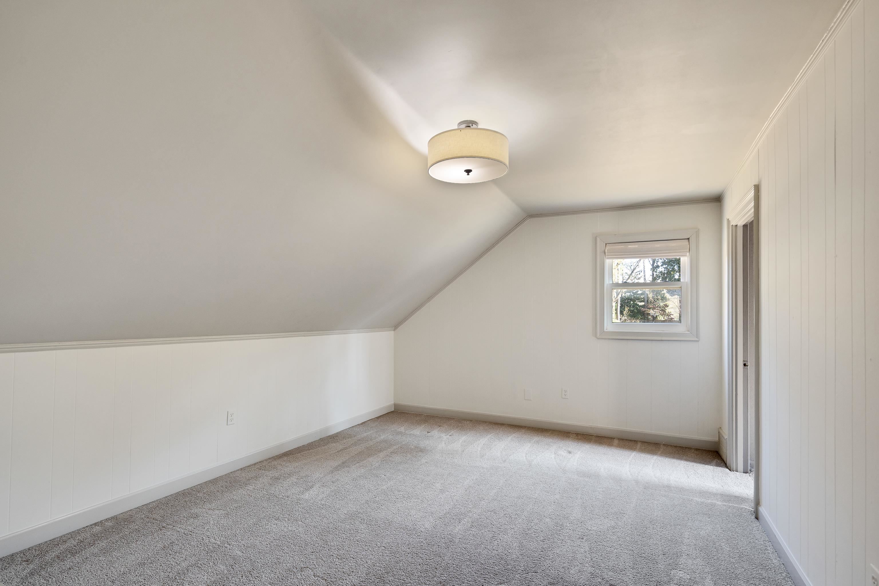 6867 River Birch Road Memphis, TN 38119 - Photo 29 of 40 Additional living space with carpet floors and vaulted ceiling