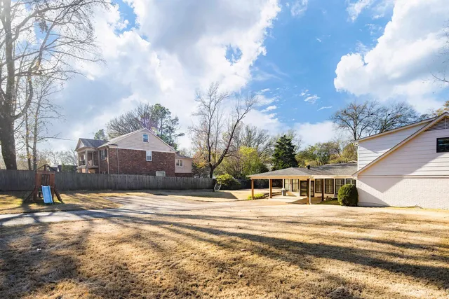 a view of a house with a snow in the background