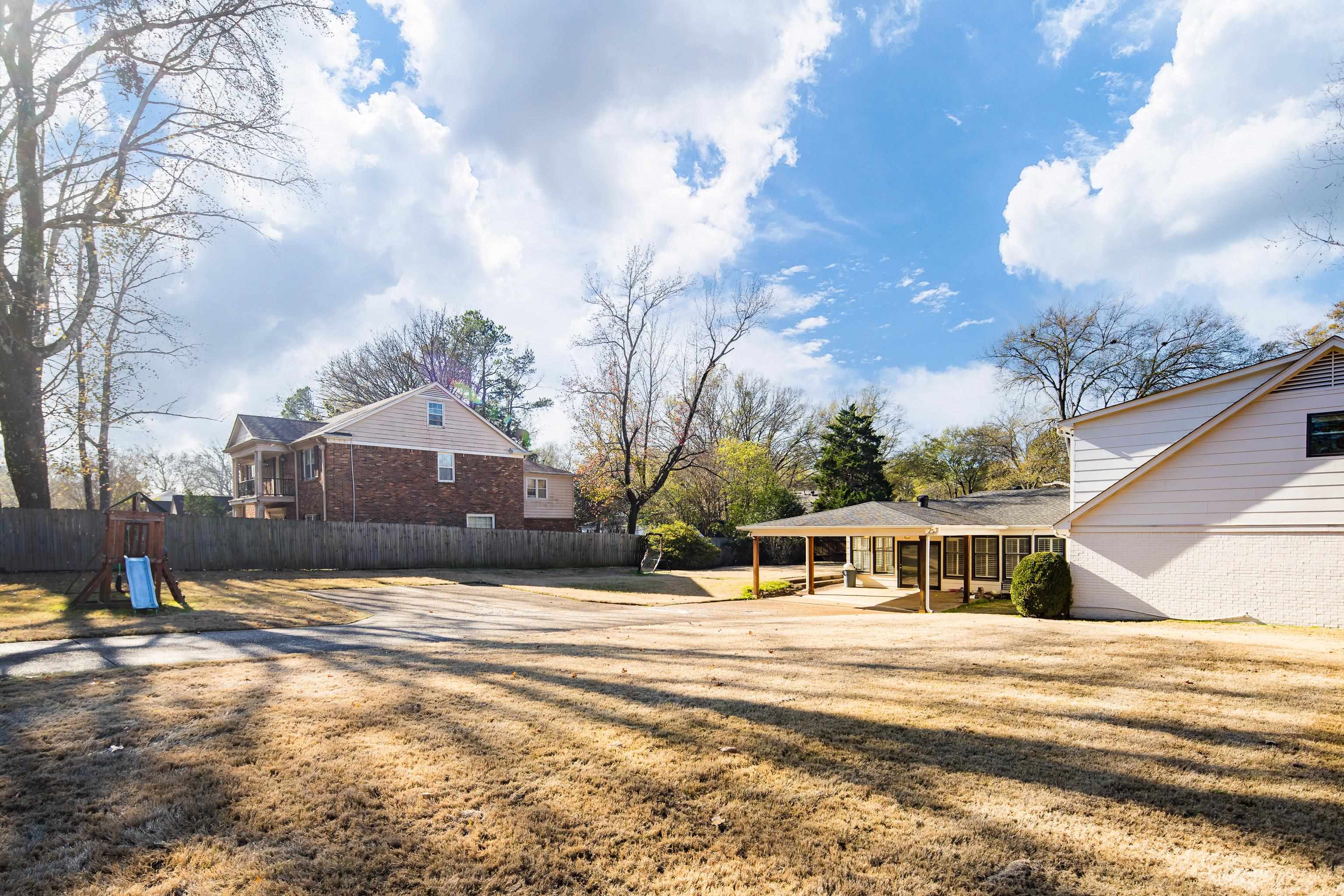 6867 River Birch Road Memphis, TN 38119 - Photo 34 of 40 View of yard with a patio