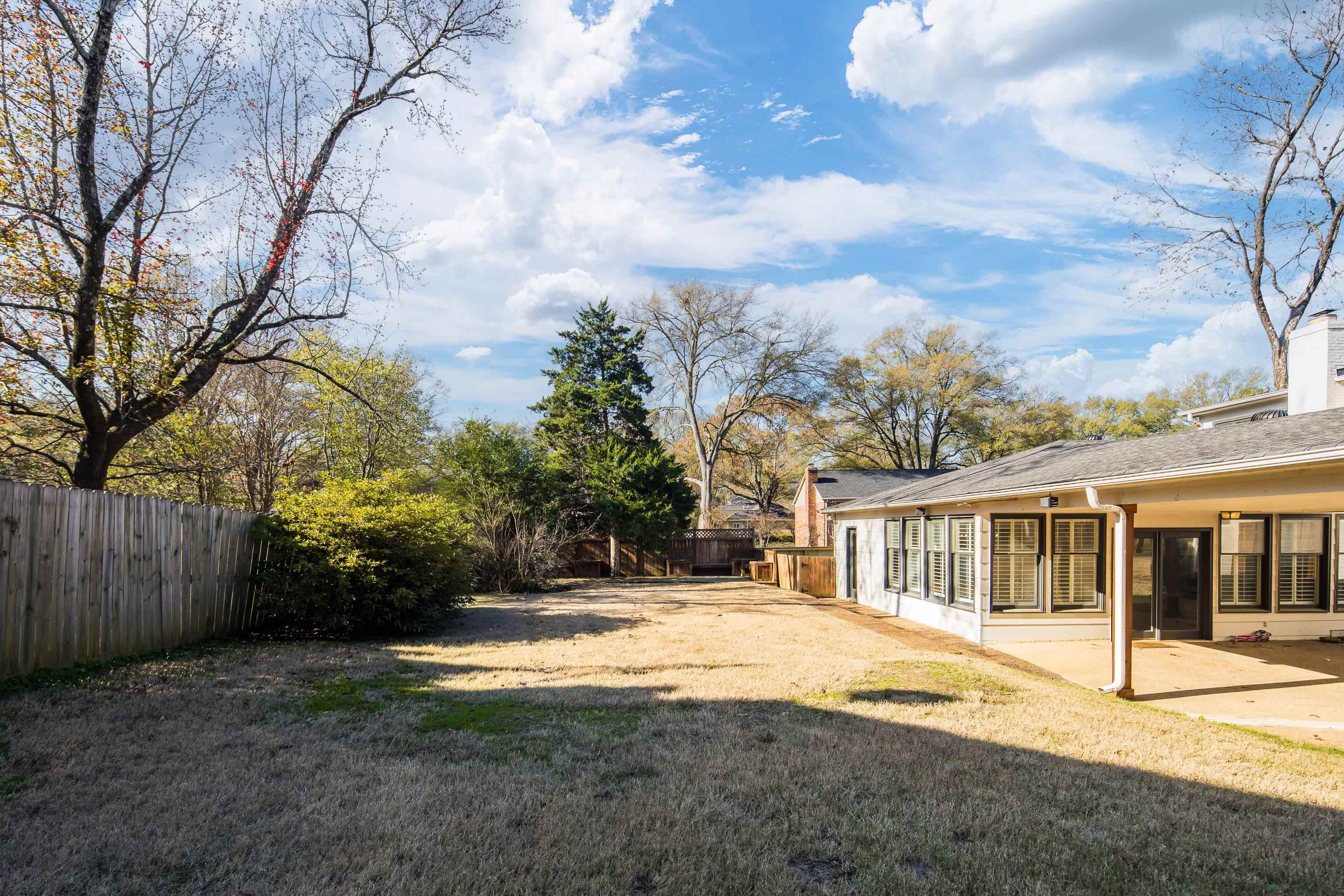 6867 River Birch Road Memphis, TN 38119 - Photo 38 of 40 Fenced backyard featuring a sunroom and a patio area