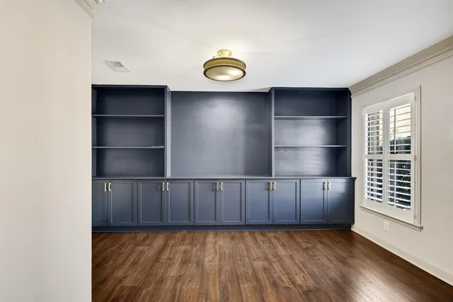 a kitchen with stainless steel appliances a stove top oven and a refrigerator