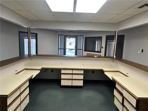 a spacious bathroom with a granite countertop sink and mirror