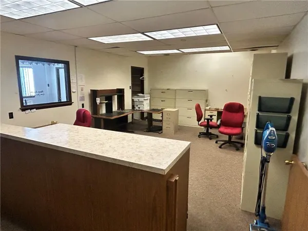 a kitchen with a refrigerator and a sink