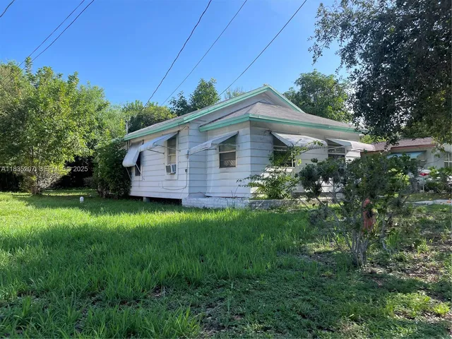 a front view of house with garden