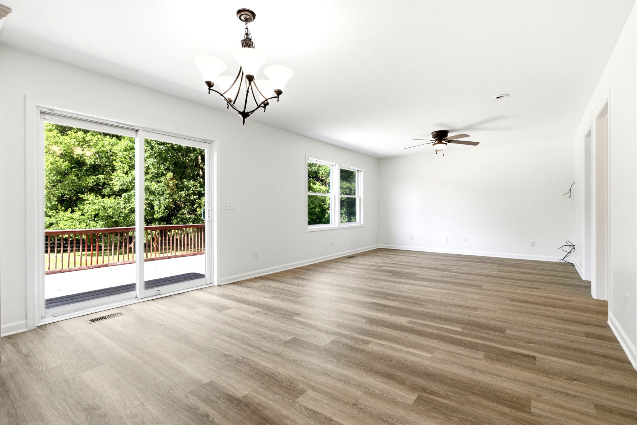 3434 Kinneys Road Cedar Hill, TN 37032 - Photo 17 of 90 a view of an empty room with wooden floor and a window