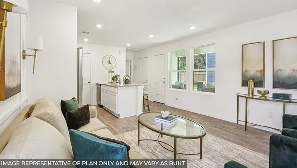 a living room with furniture and a table