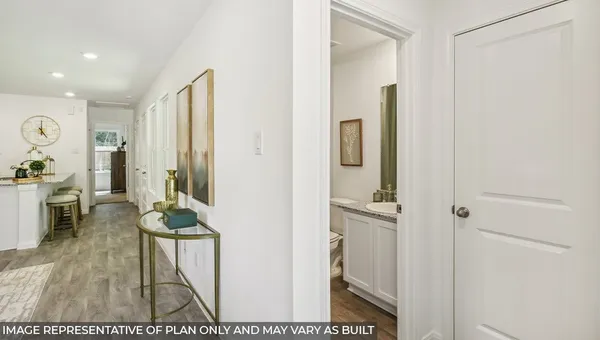 a view of a hallway and dining room