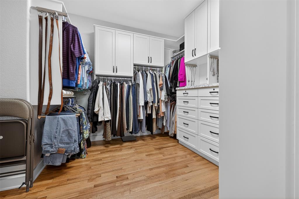 221 Proctor Lane Decatur, TX 76234 - Photo 22 of 30 a view of walk in closet with clothes