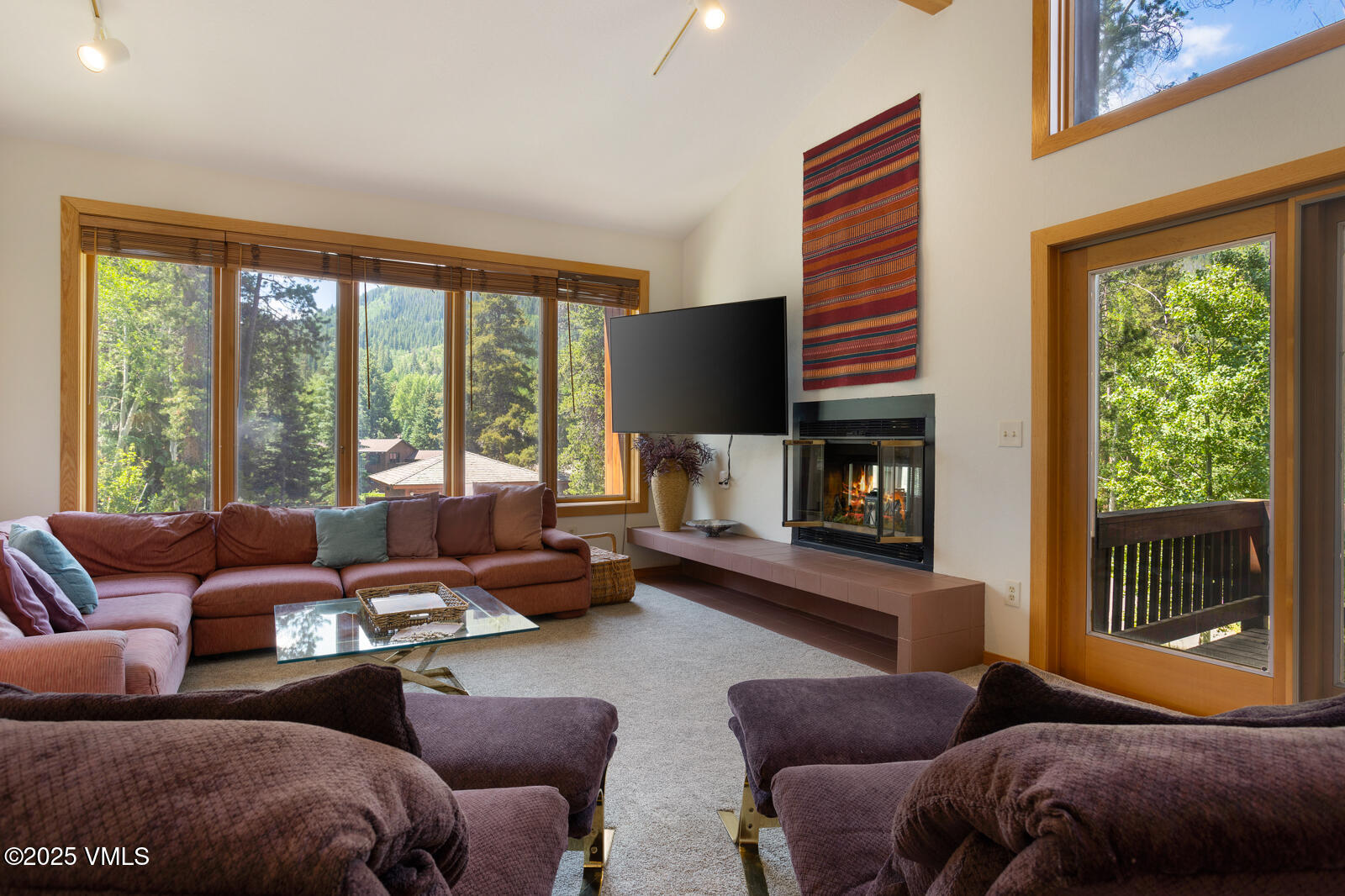 5159 Gore Circle Vail, CO 81657 - Photo 13 of 62 a living room with furniture and a fireplace