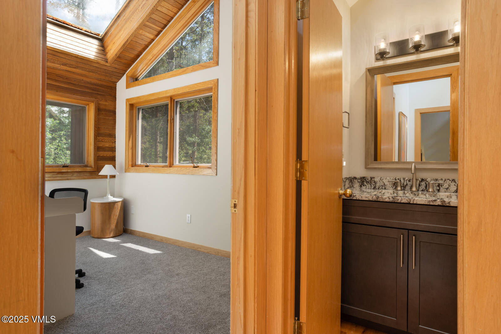 5159 Gore Circle Vail, CO 81657 - Photo 24 of 62 a view of a bathroom with a sink and mirror