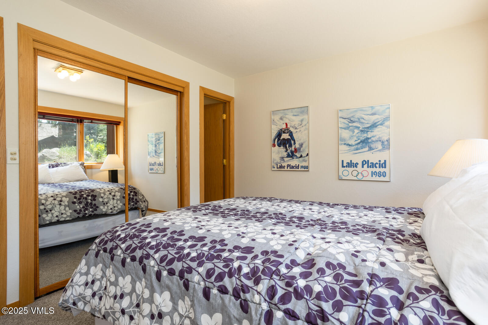 5159 Gore Circle Vail, CO 81657 - Photo 30 of 62 a bedroom with a large bed and wooden floor