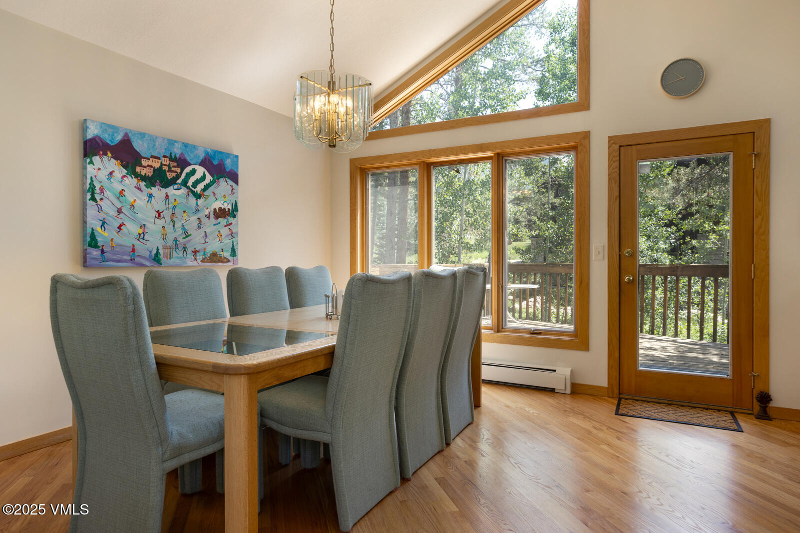 5159 Gore Circle Vail, CO 81657 - Photo 34 of 62 a view of a dining room with furniture a chandelier and wooden floor