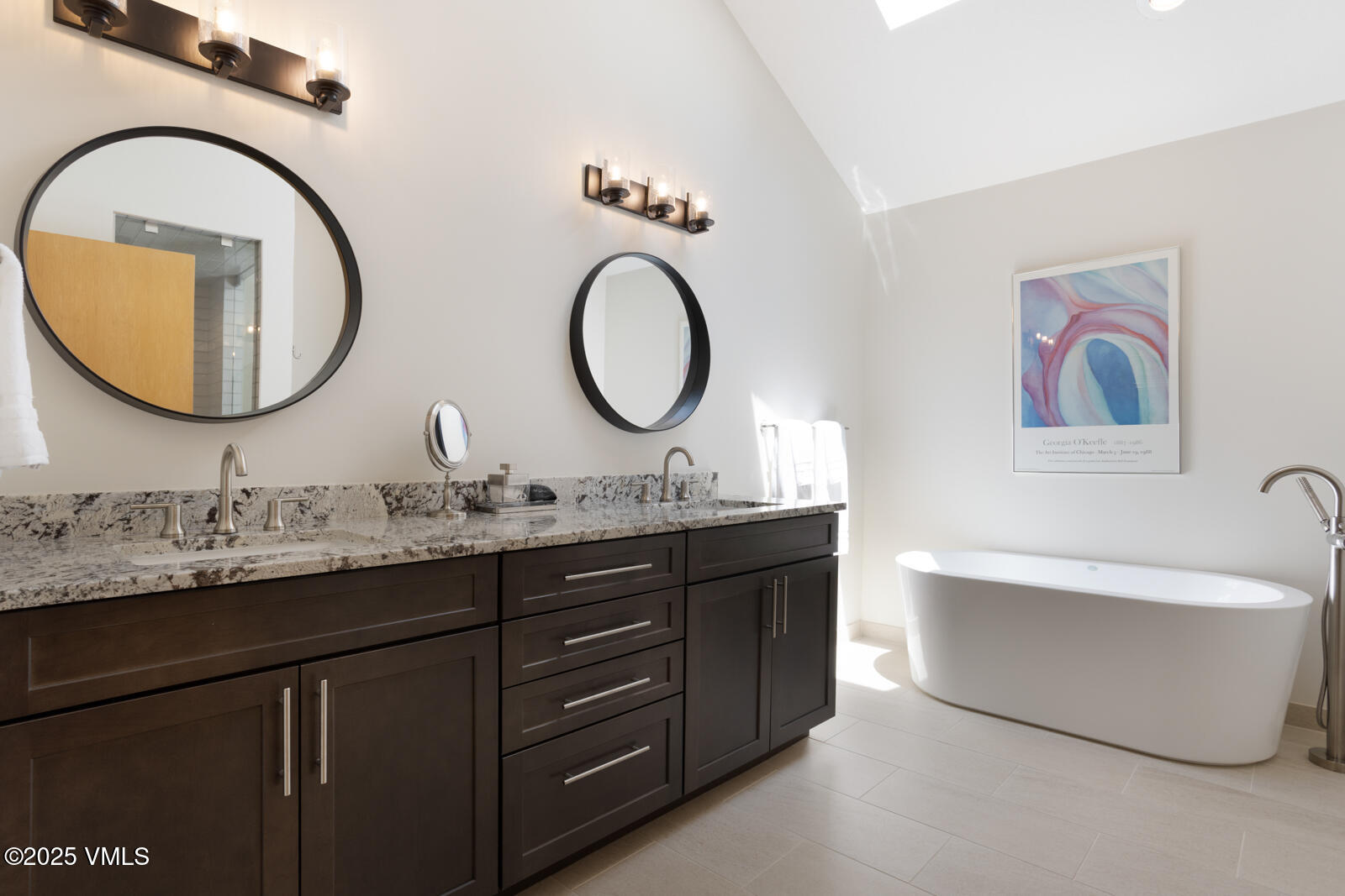 5159 Gore Circle Vail, CO 81657 - Photo 37 of 62 a bathroom with a granite countertop double vanity sink and a mirror