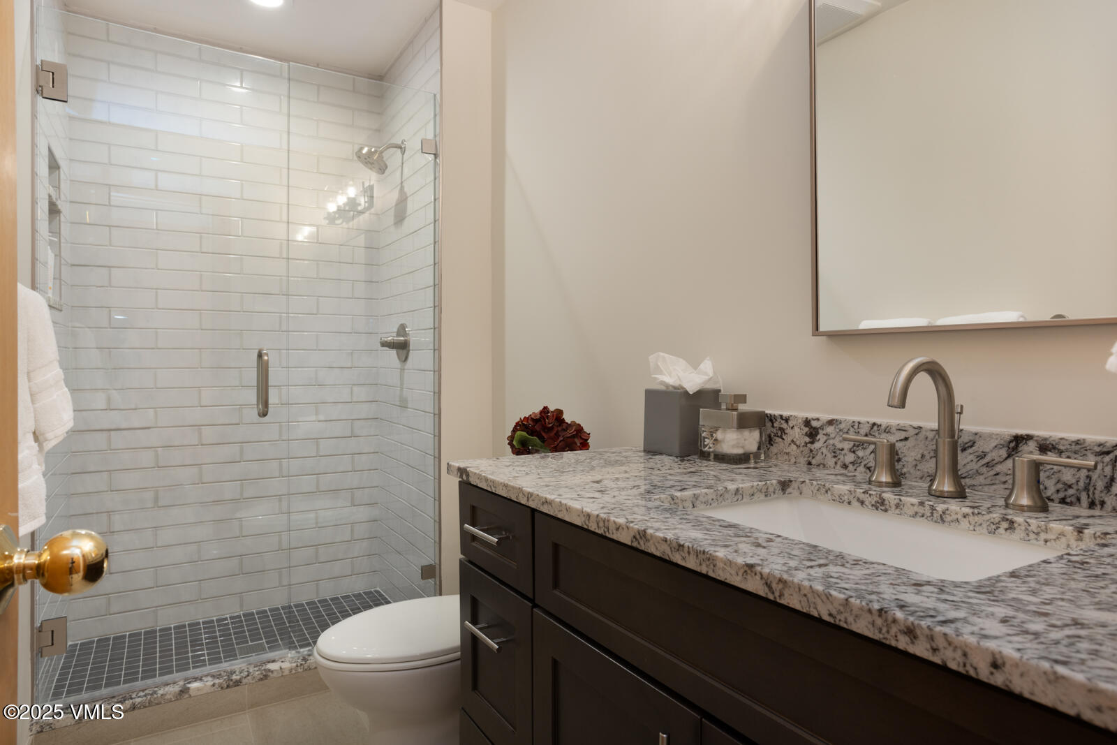 5159 Gore Circle Vail, CO 81657 - Photo 43 of 62 a bathroom with a granite countertop sink a toilet and mirror