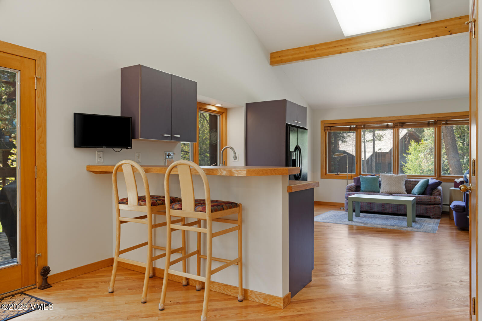 5159 Gore Circle Vail, CO 81657 - Photo 7 of 62 a living room with furniture a flat screen tv and a large window