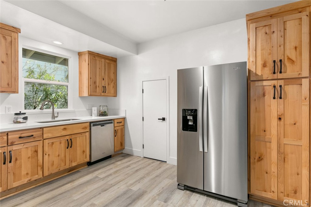 937 Chestnut Street Chico, CA 95928 - Photo 17 of 55 a kitchen with stainless steel appliances granite countertop a refrigerator and a sink