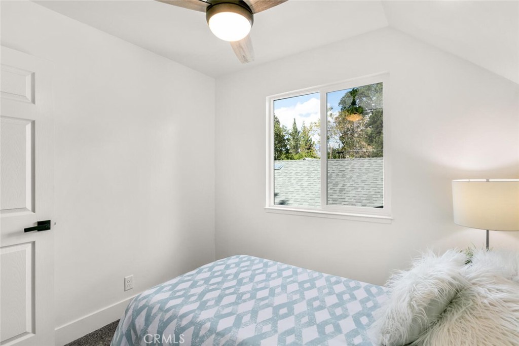 937 Chestnut Street Chico, CA 95928 - Photo 26 of 55 a bedroom with a bed and a lamp