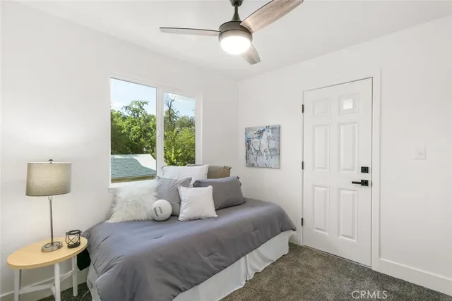 a bedroom with bed and window