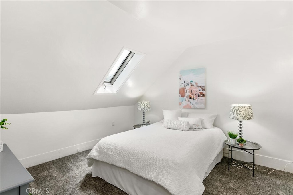 937 Chestnut Street Chico, CA 95928 - Photo 29 of 55 a bedroom with a bed and a painting on the wall