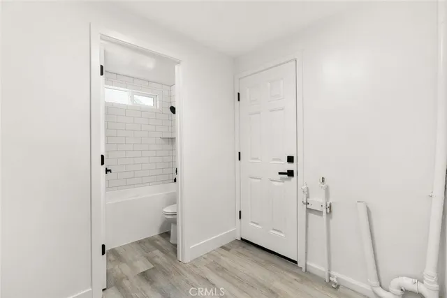 a bathroom with a shower and a sink